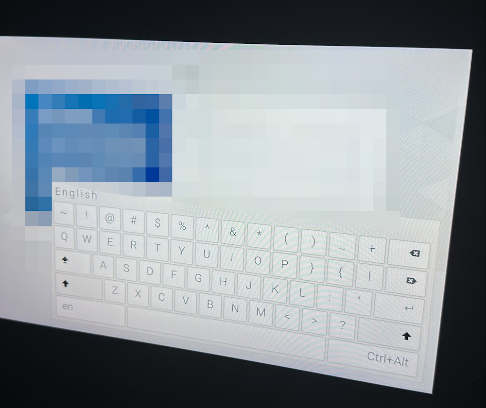 picture of a device screen showing an on screen keyboard. The device's screen is blurred allowing for visual emphasis on the on screen keyboard that is showing.